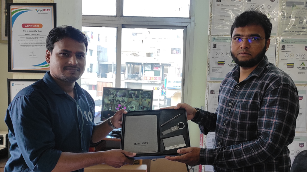 An Ambrits trainer receiving the IDP IELTS partner accreditation kit